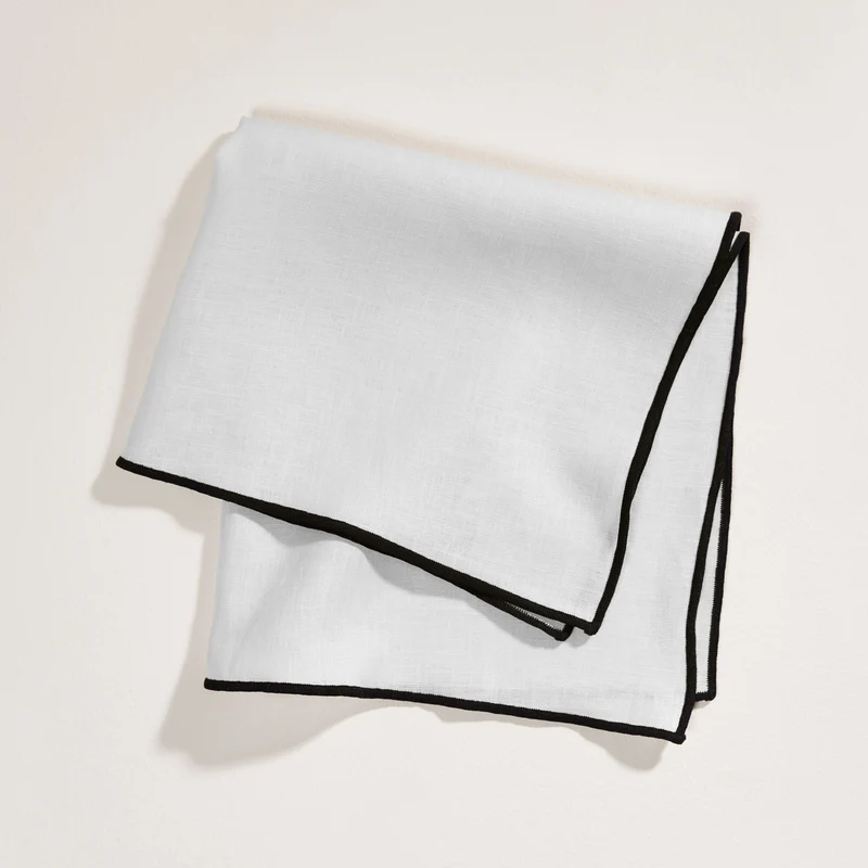 Serviette de table CARLINA blanc pur et bourdon noir