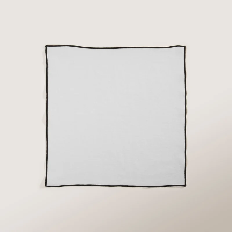 Serviette de table CARLINA blanc pur et bourdon noir
