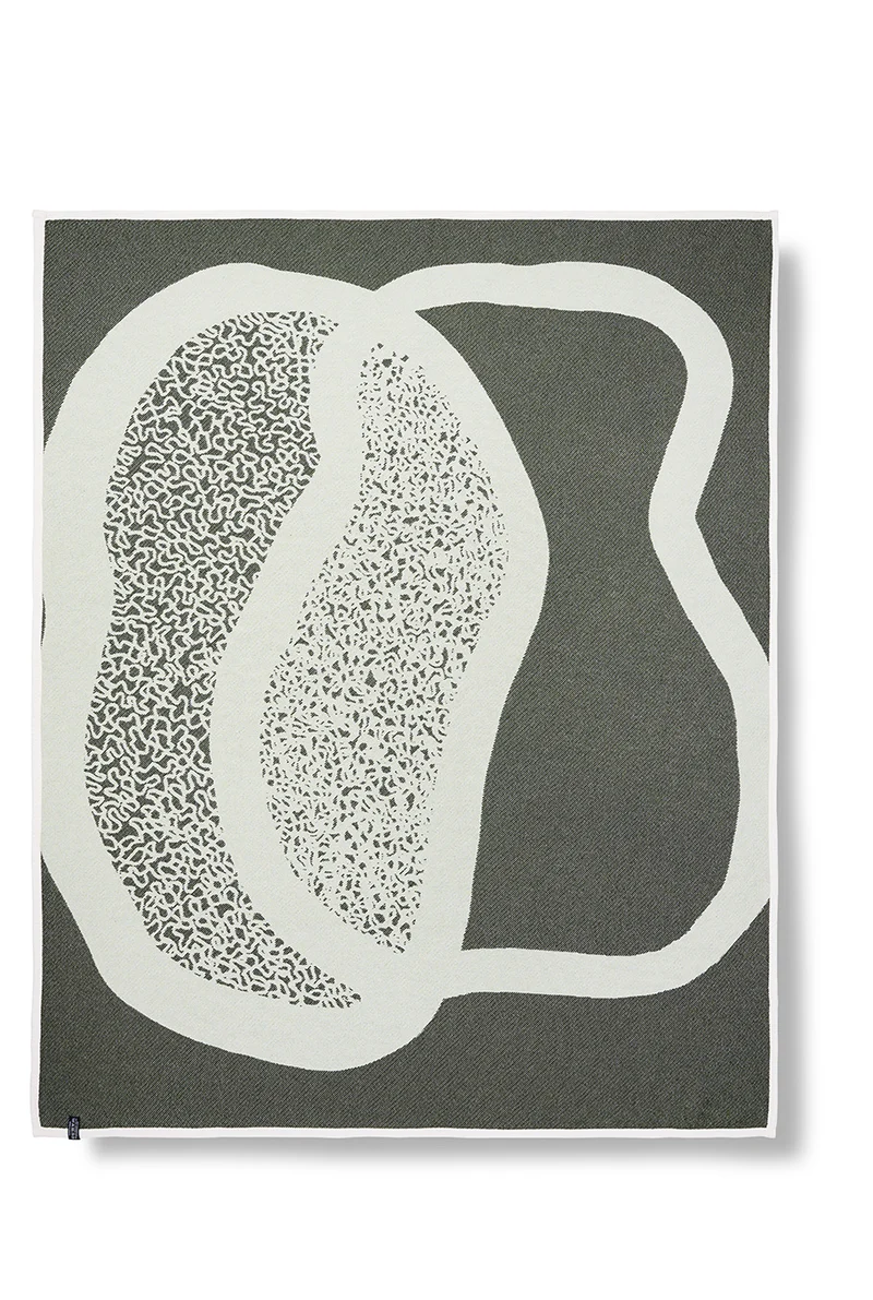 Cotton Blanket “Merging Islands” in Tea Green by Roland Schär