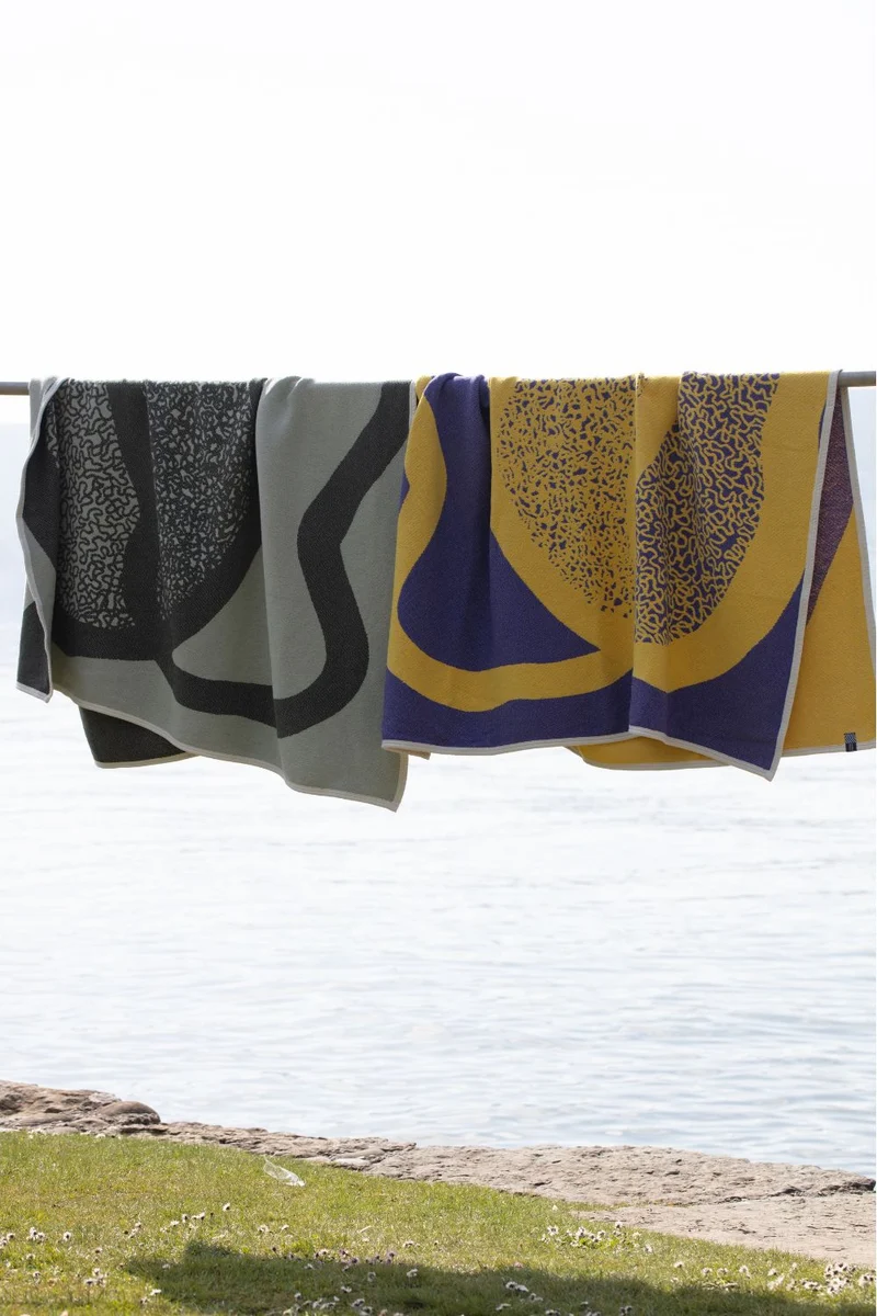 Cotton Blanket “Merging Islands” in Tea Green by Roland Schär